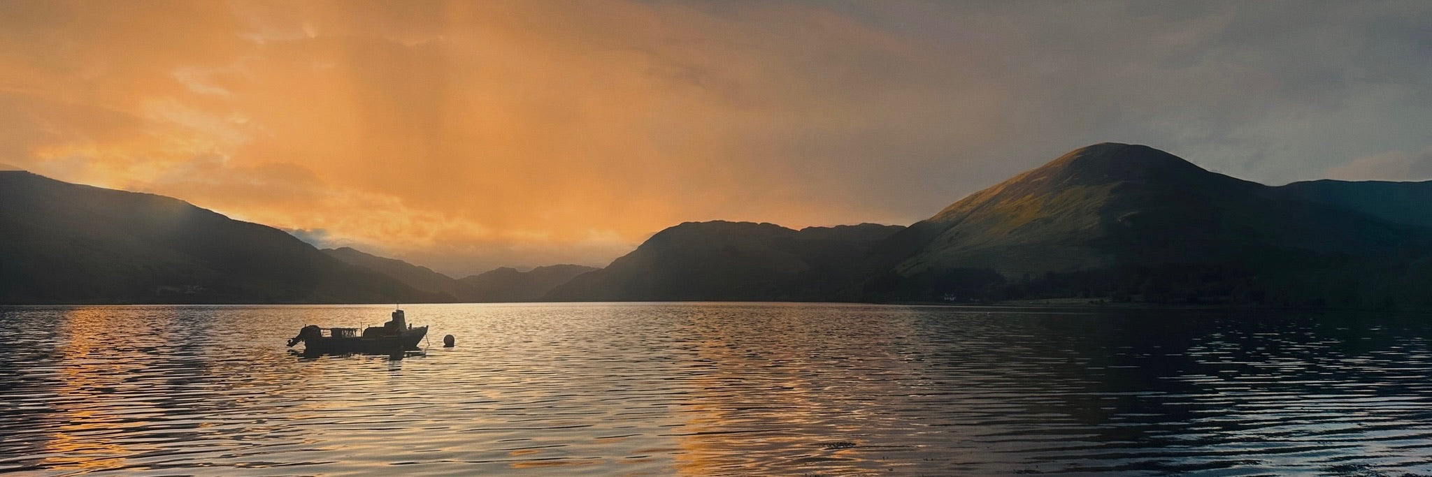 Loch Striven Dusk Panoramic Prints featuring a fishing boat on a lake at sunset