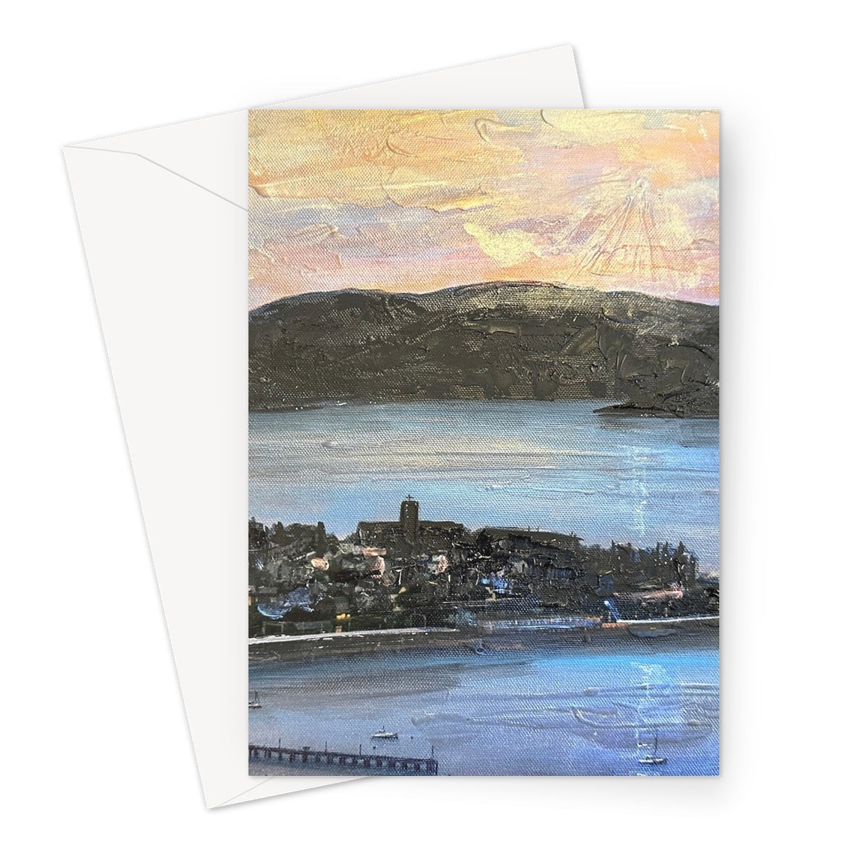Blue and white From Lyle Hill greeting card with coastal mountains, water, buildings, and pier