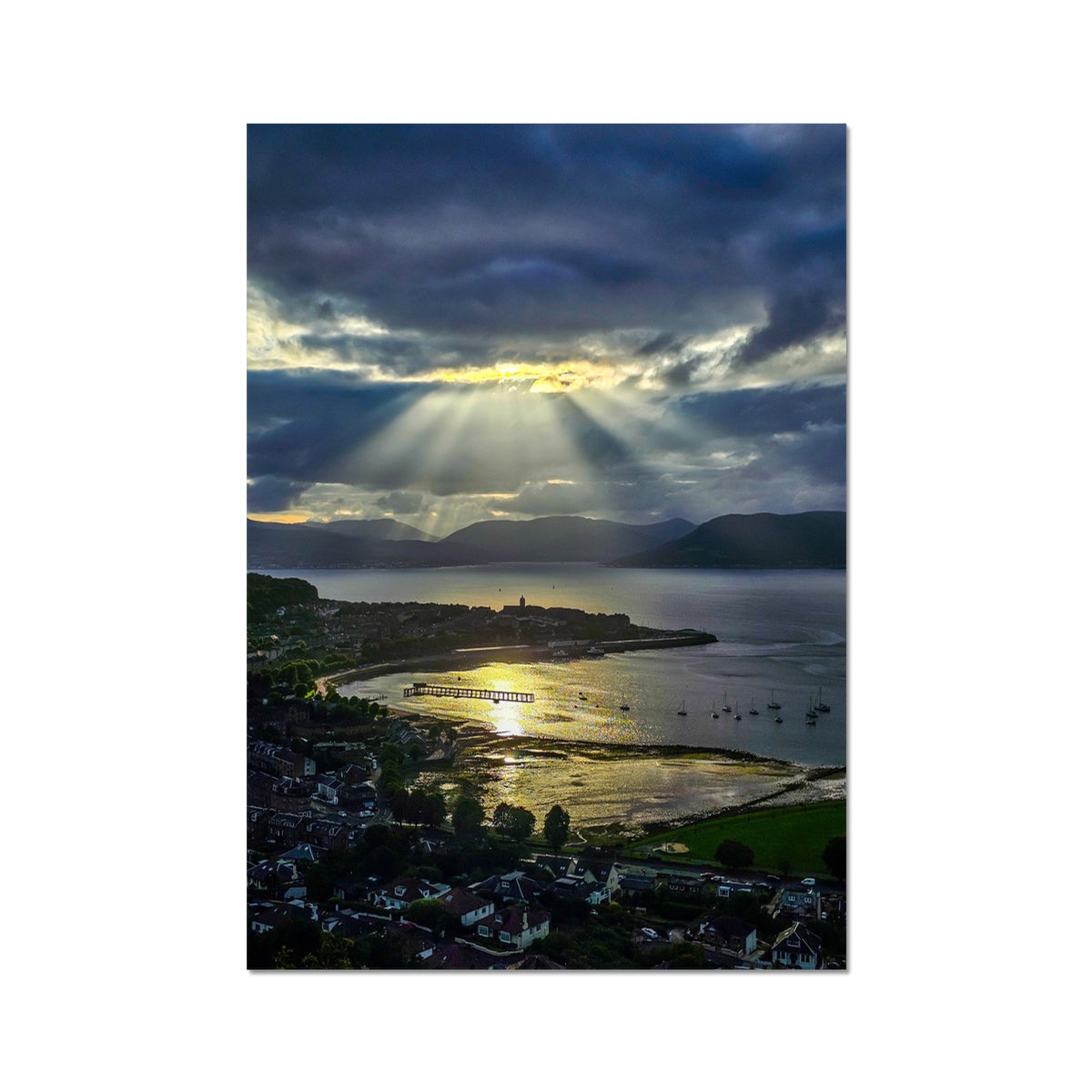 Dramatic sunbeams through clouds over serene coastal harbor in Lyle Hill View print