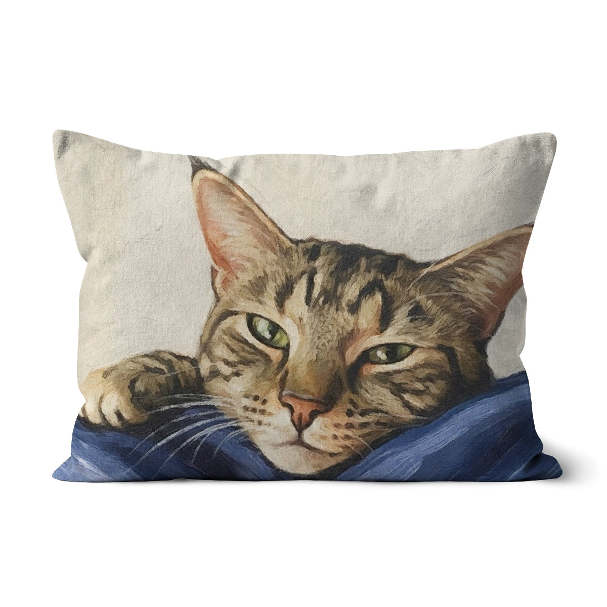 Mitzi tabby cat portrait cushion with green eyes on blue blanket