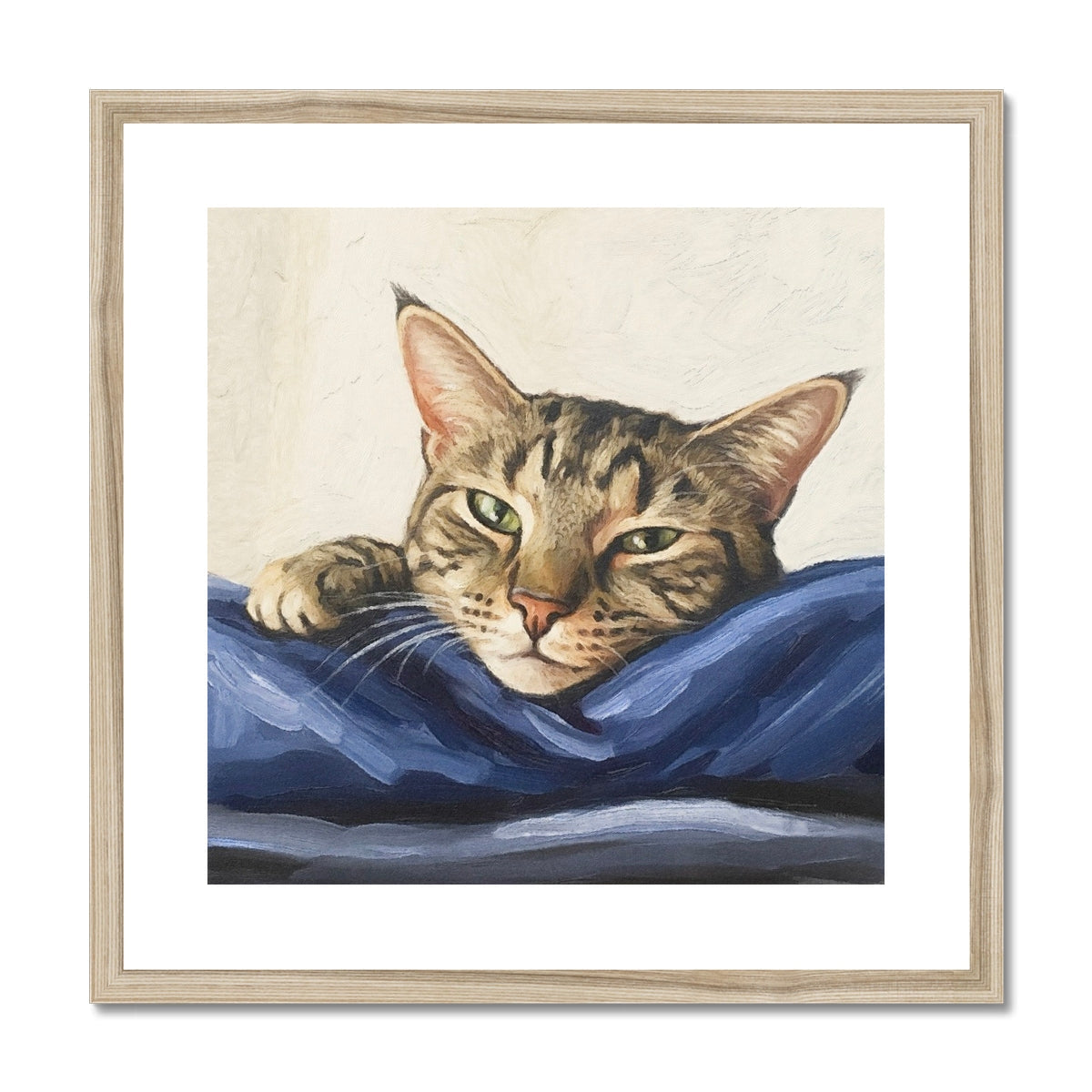 Framed Mitzi tabby cat portrait with green eyes on blue fabric