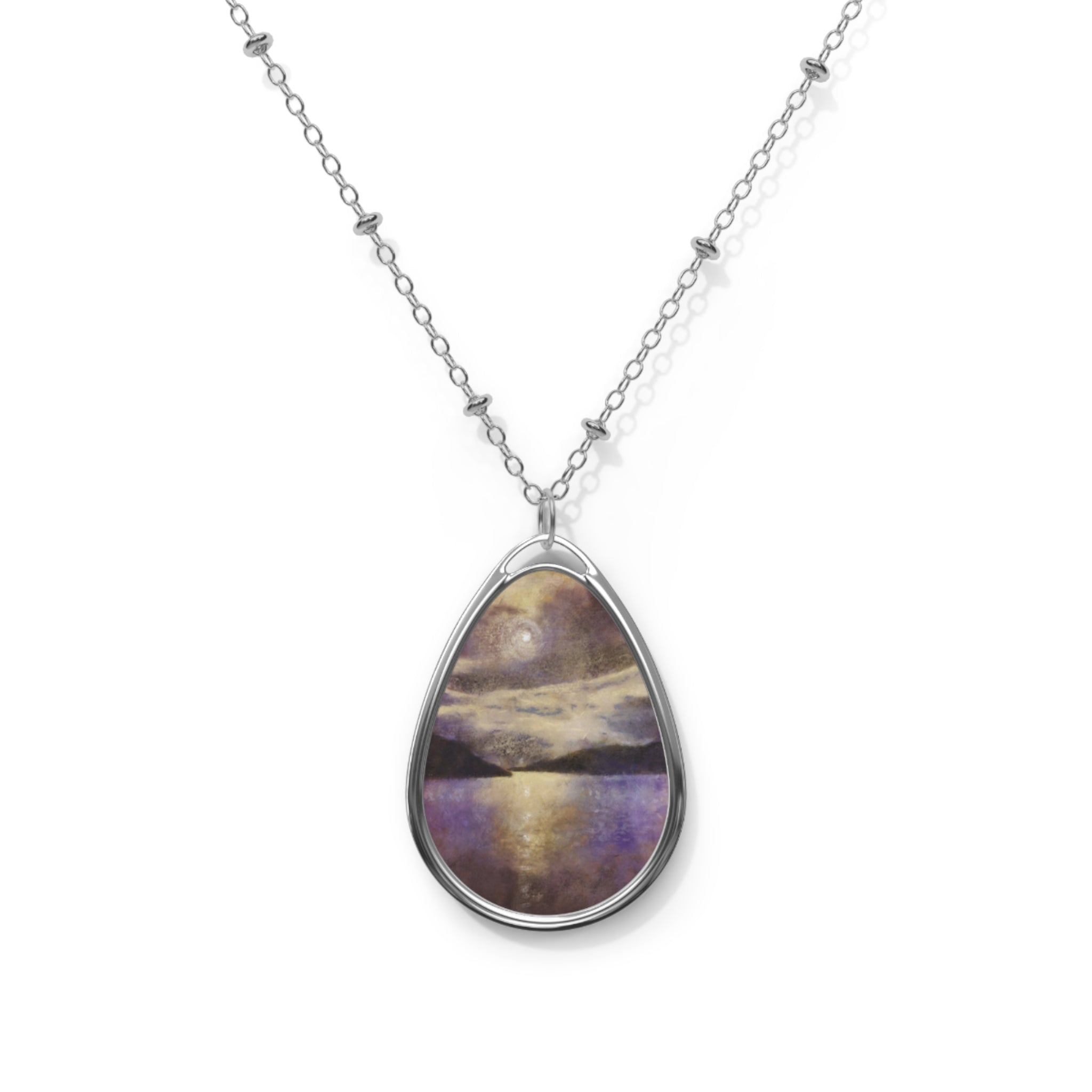 Silver chain necklace with oval pendant featuring a painted moonlit lake landscape