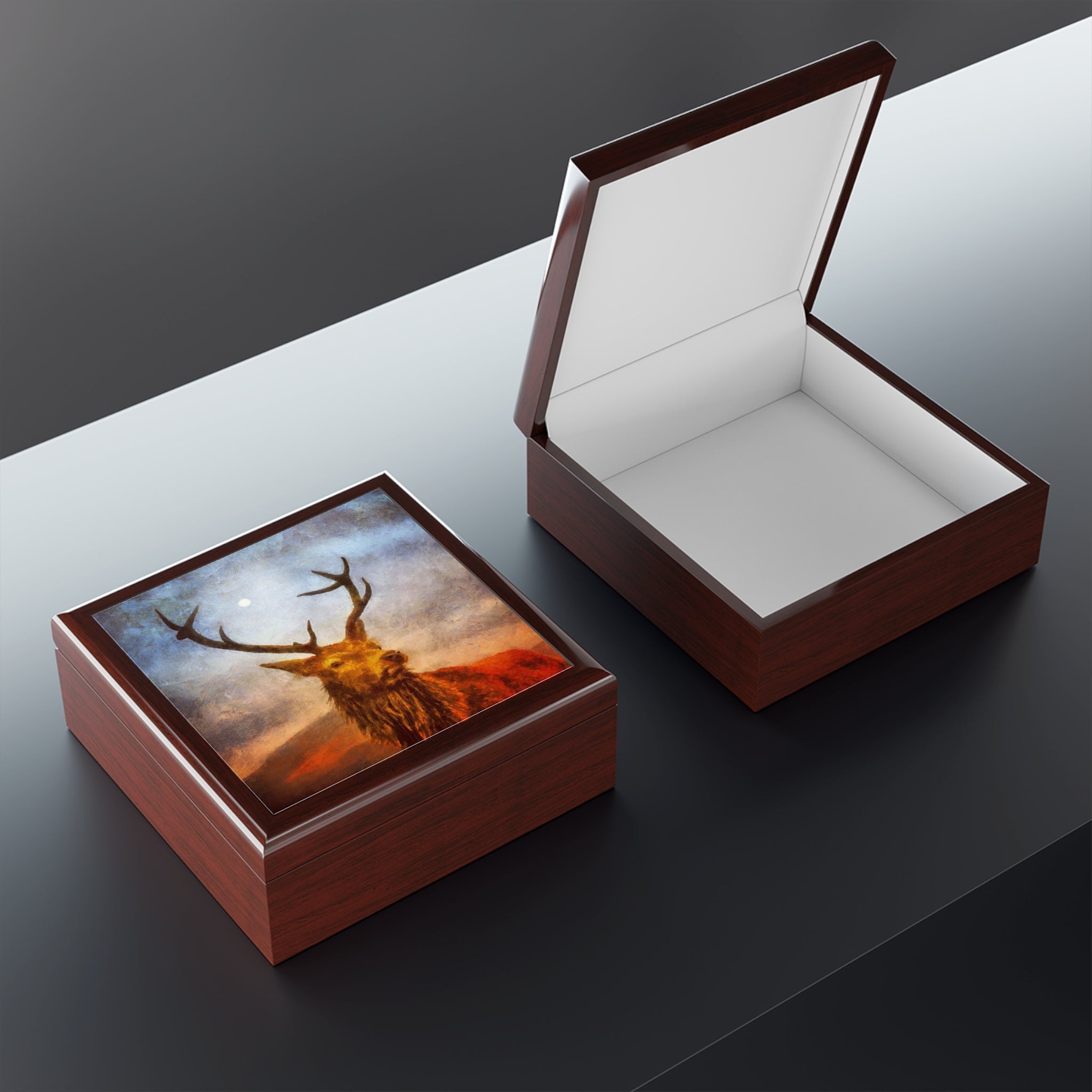 Wooden keepsake boxes featuring a Highland stag design, one open with white interior