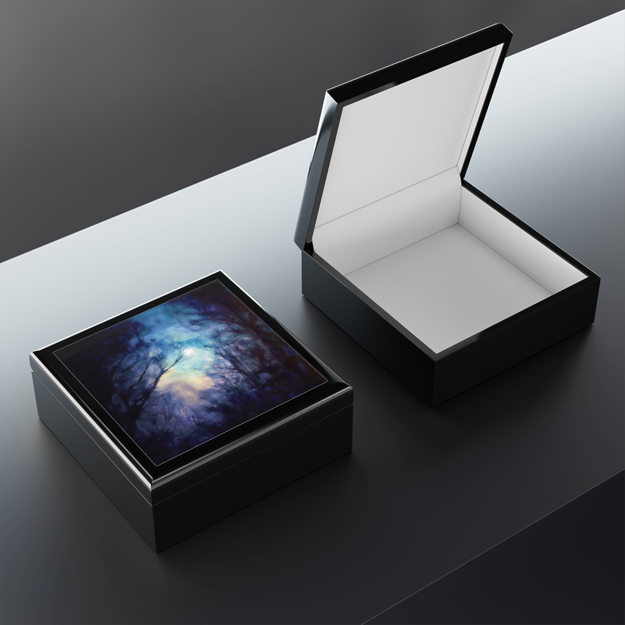 Elegant black wooden keepsake boxes from A Moonlit Highland Wood Scotland, one open and one closed