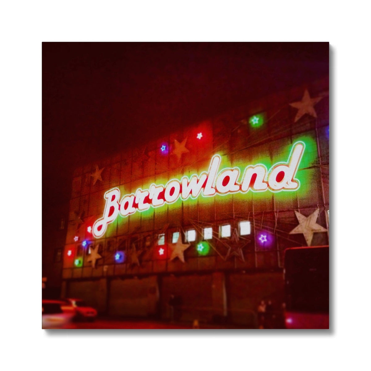 Glowing neon Barrowlands sign in green and red with colorful star lights