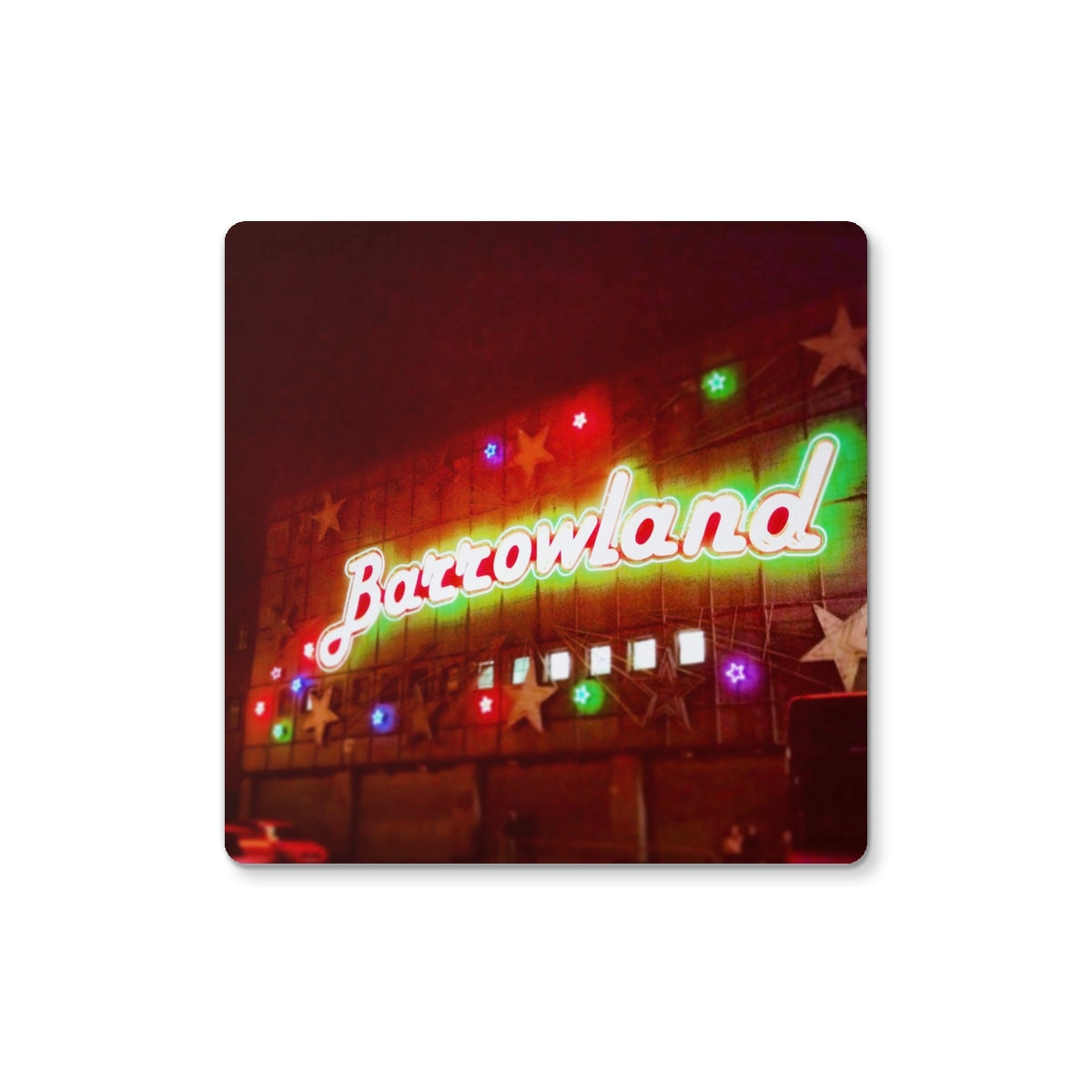Vibrant neon Barrowlands sign on Glasgow coaster with green red glow and colorful stars
