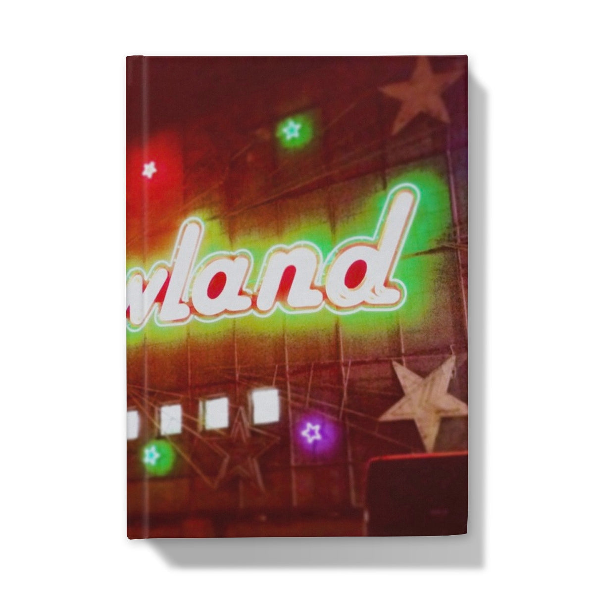 Neon-lit Wand sign glowing green and red on star lights in Neon Glasgow Barrowlands journal
