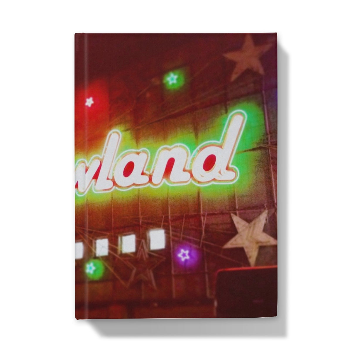 Neon-lit Barrowlands signbook in glowing green and red on journal
