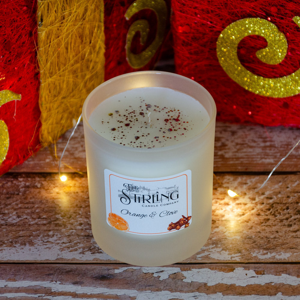 Orange & Clove medium candle from String Candle Company with frosted glass and specks