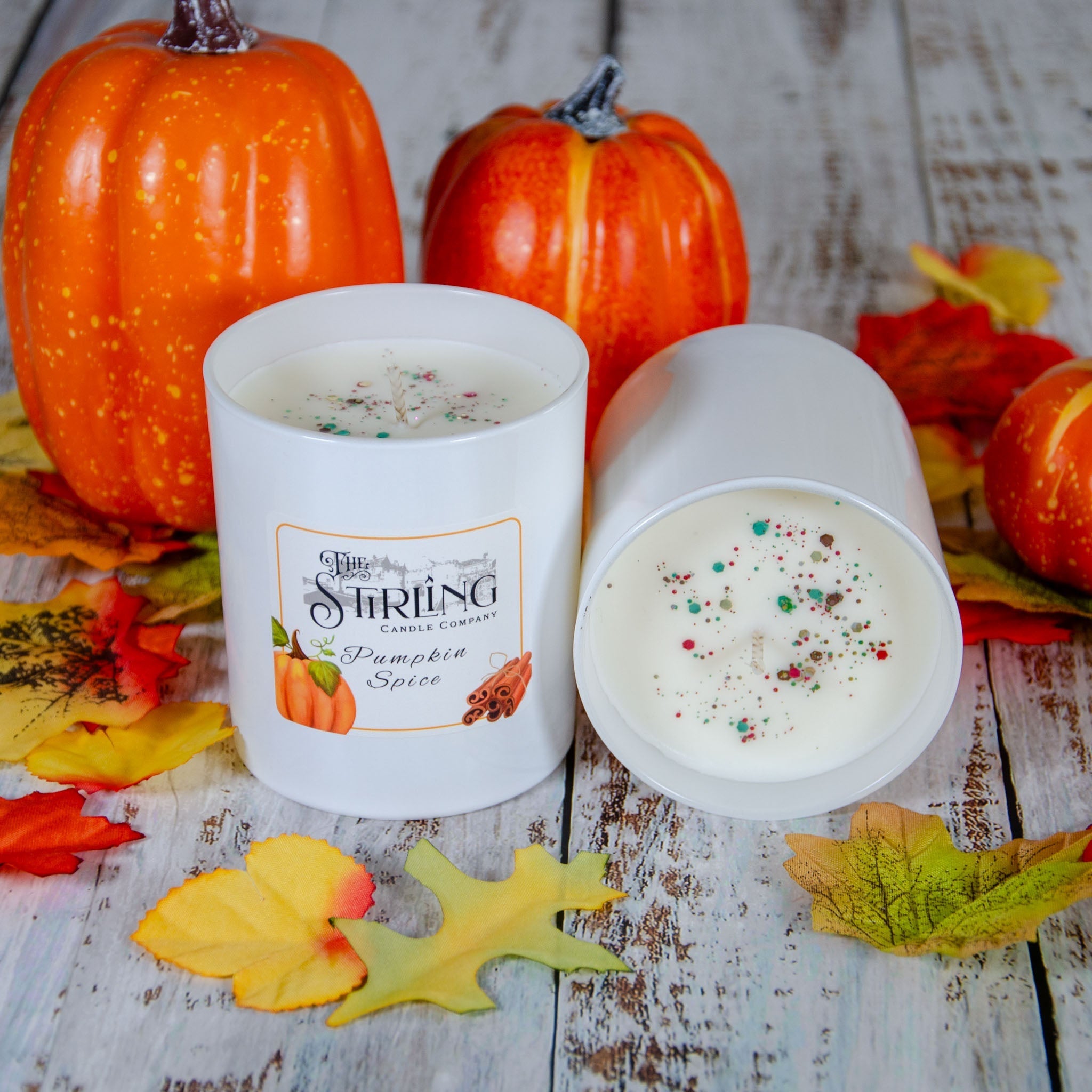 Large pumpkin spice candle in white ceramic with colorful speckles