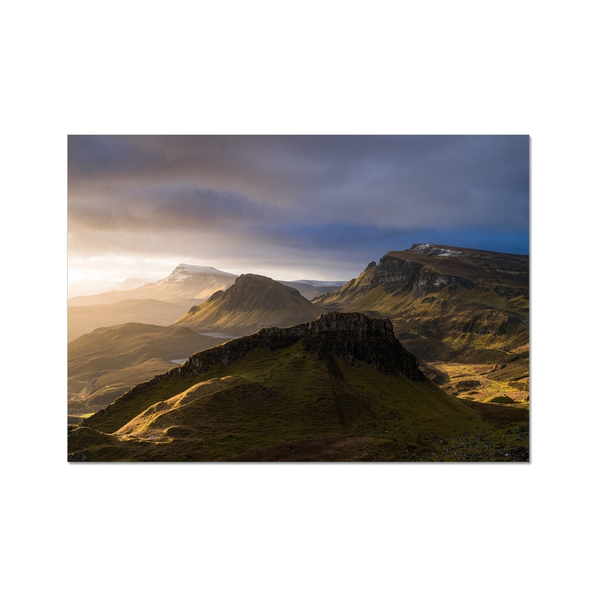 Quiraing Sunrise fine art print of rugged sunlit mountains under dramatic sky