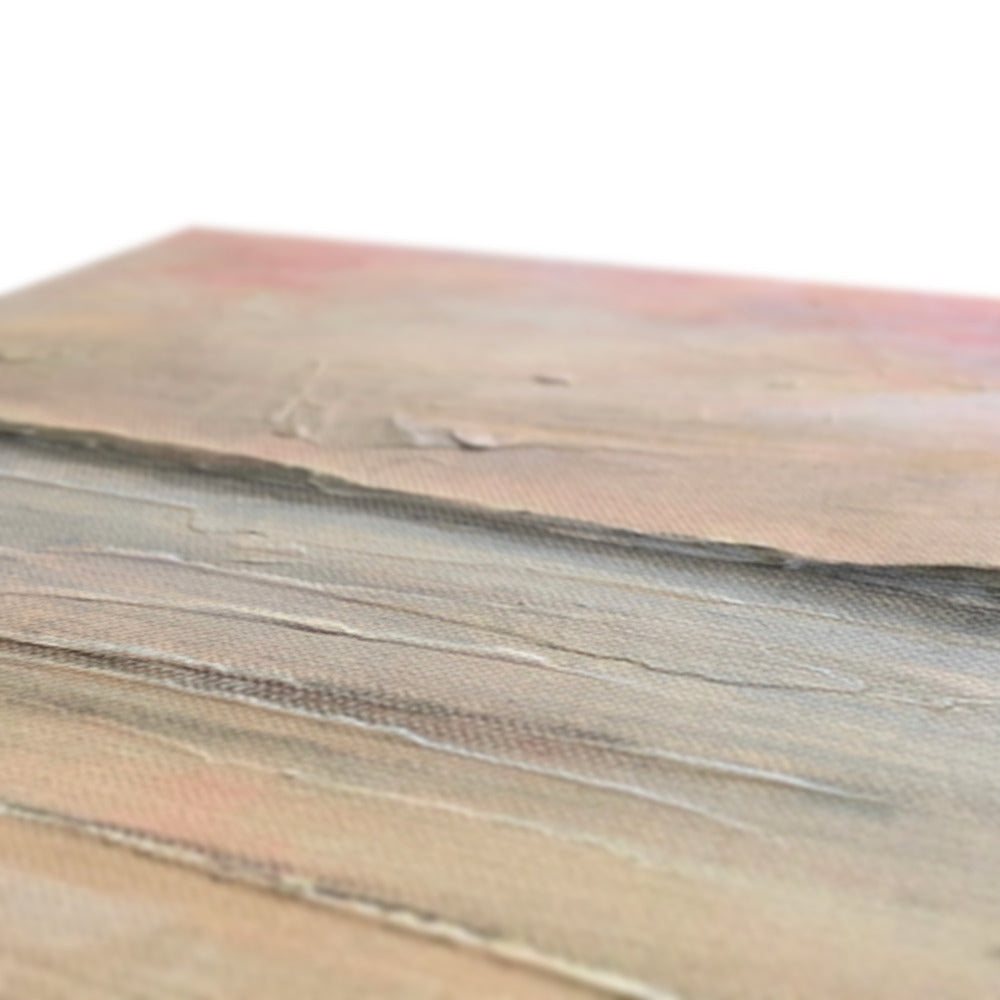 Brown leather wallet with textured surface and metallic accents