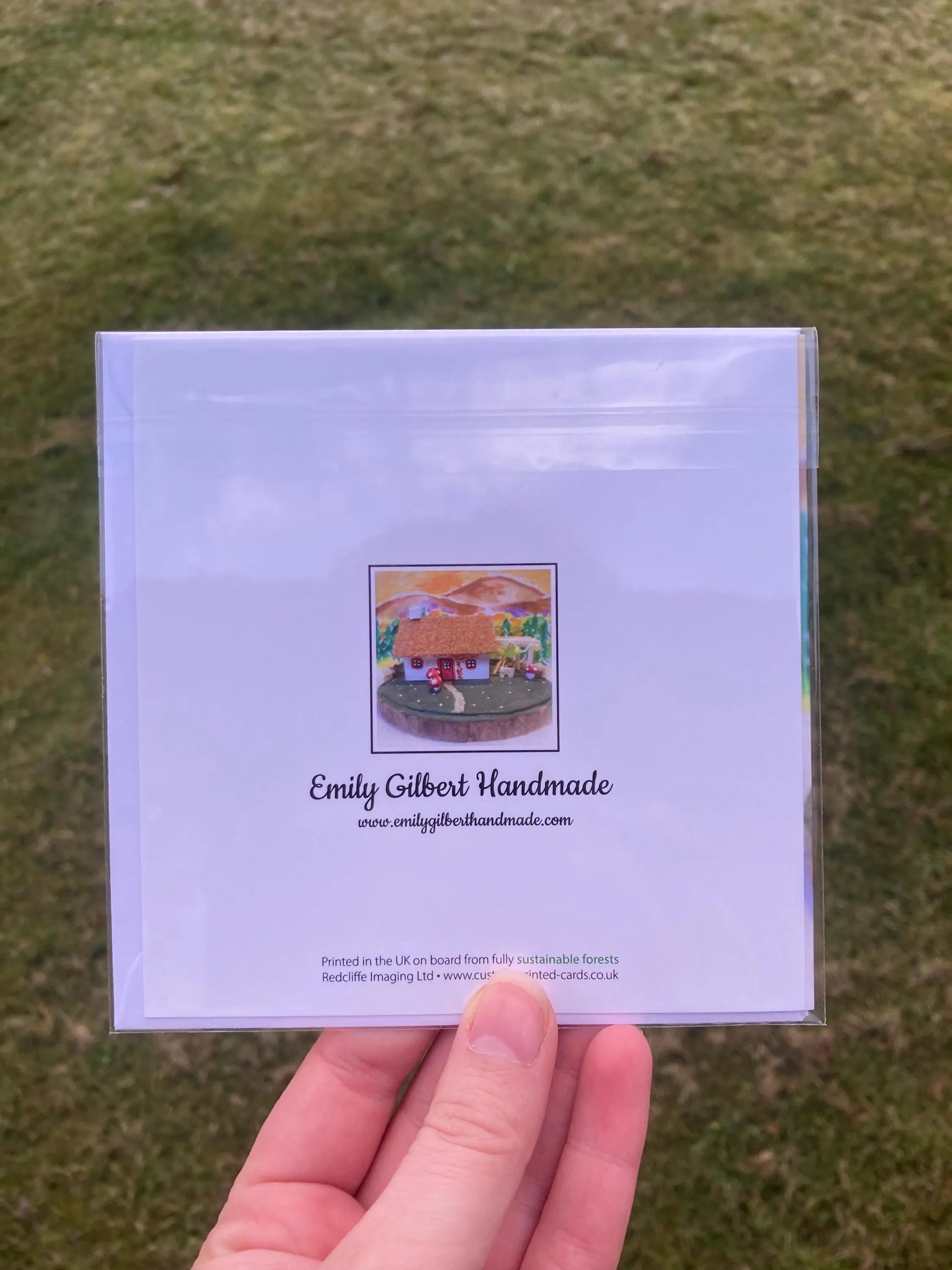 White greeting card with colorful Highland Bothy illustration and Emily Gilbert Handmade branding