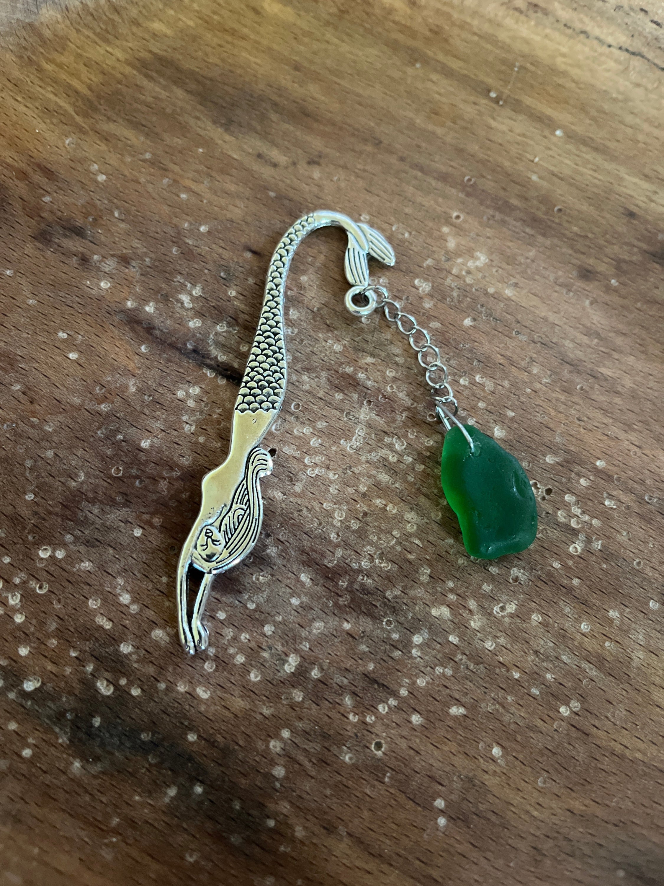 Silver fish bookmark with green jade pendant, mermaid tails design