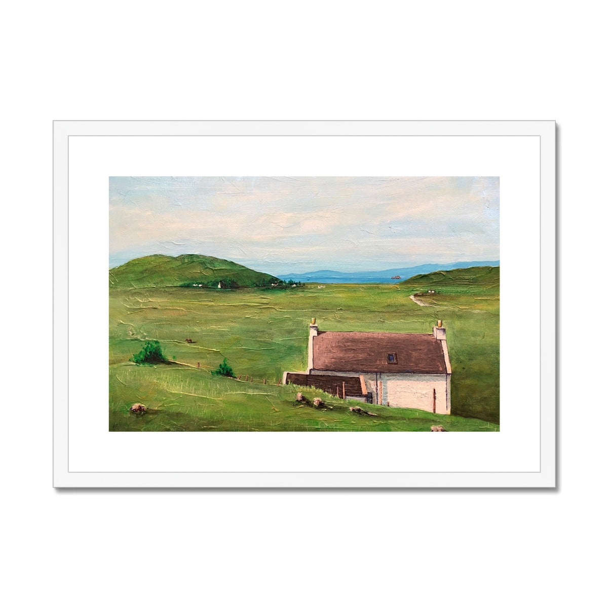 Framed landscape painting of a house in a lush green field for A Skye Cottage print