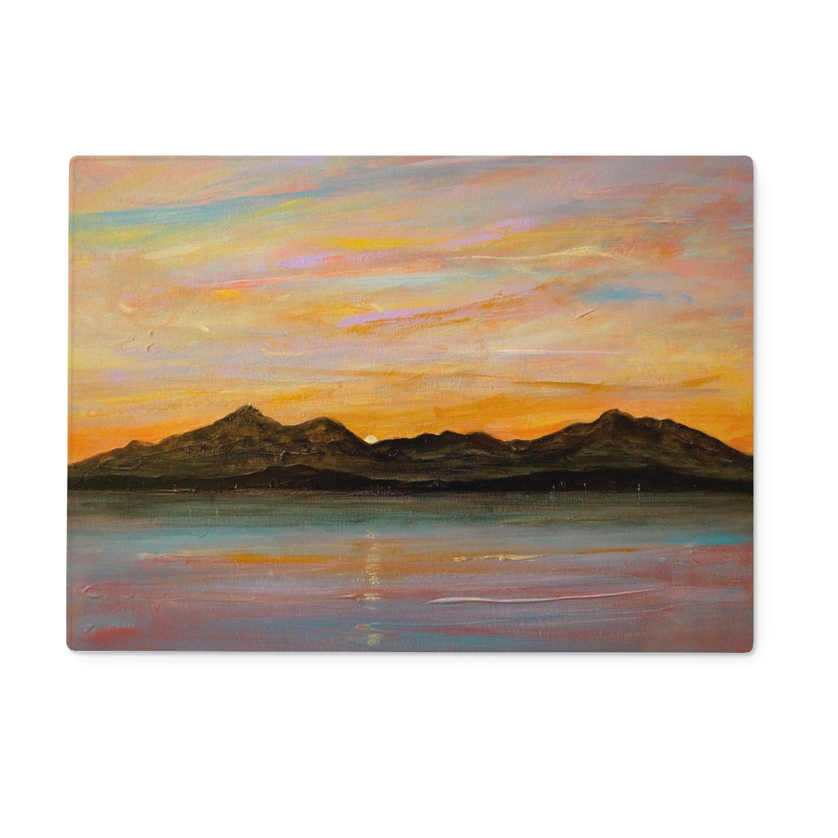 Vibrant landscape painting of sunset over mountains and water on The Sleeping Warrior Arran Glass Chopping Board