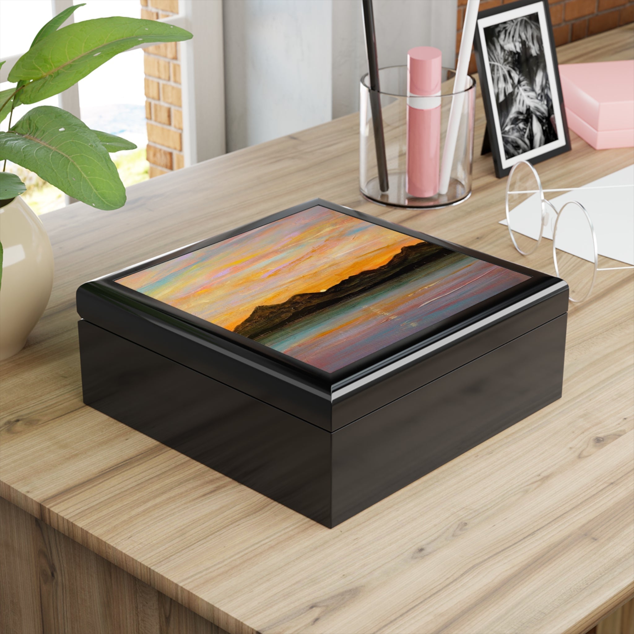 The Sleeping Warrior Arran jewelry box with glossy black finish and sunset lid