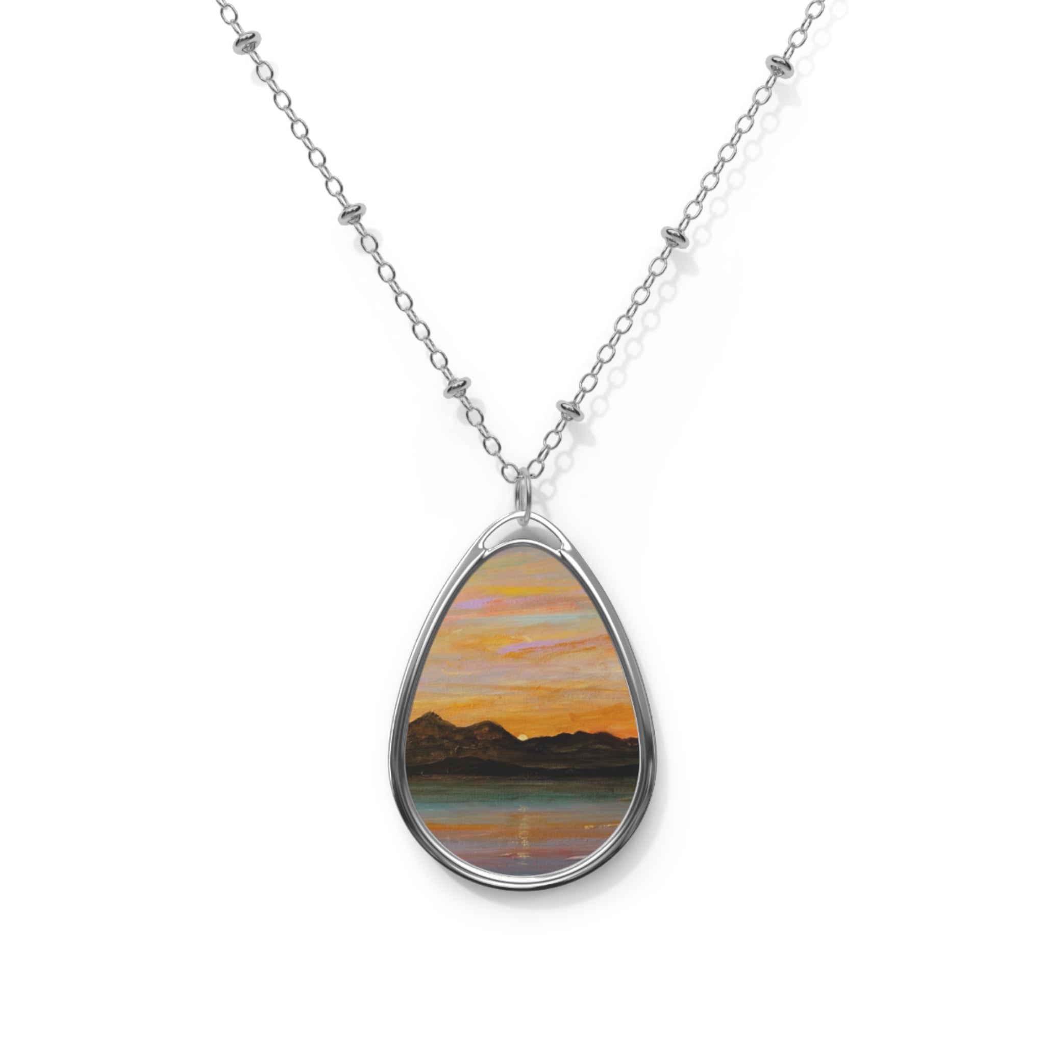 Silver teardrop pendant necklace with painted sunset over mountains, The Sleeping Warrior Arran Scottish art jewelry