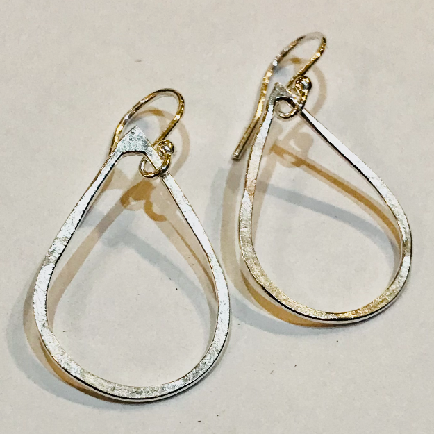 Small teardrop hoop earrings in silver and gold tones by Genna Miller Jewellery