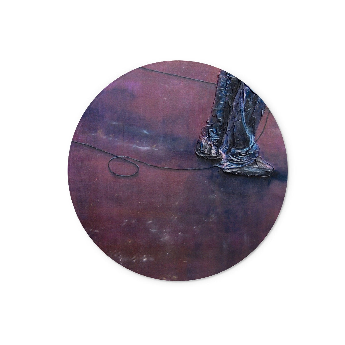 Dark bronze circular plaque with weathered boots and coiled wire on Soundcheck Glasgow Barrowlands glass chopping board