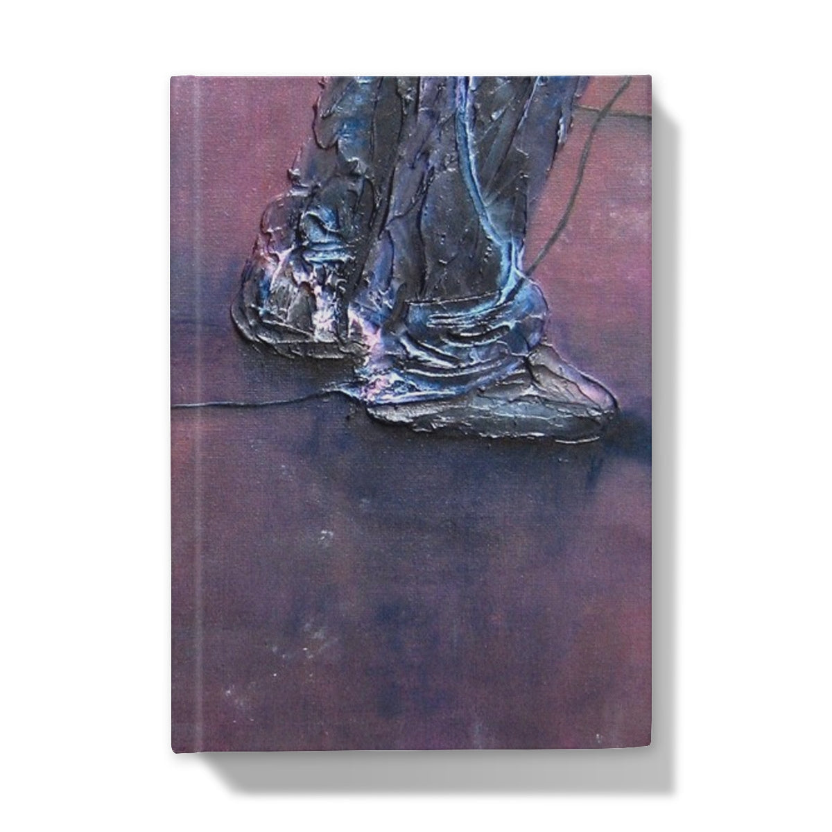 Textured dark metallic boot foot sculpture on reddish-brown surface, Soundcheck Glasgow Barrowlands journal