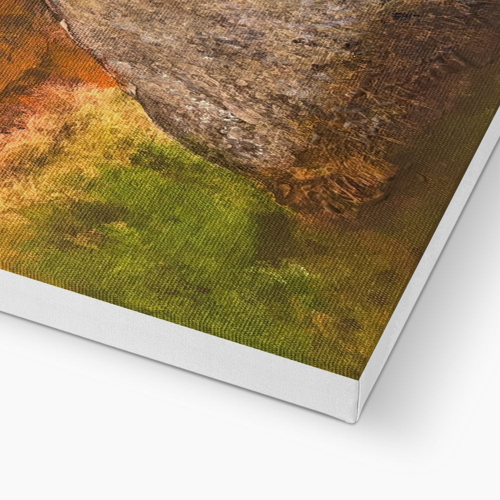 Standing still in glencoe canvas print featuring textured earthy landscape with green grass and brown rock formations