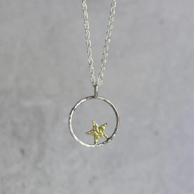 Delicate silver Star Hoop Necklace with textured circular pendant and golden star