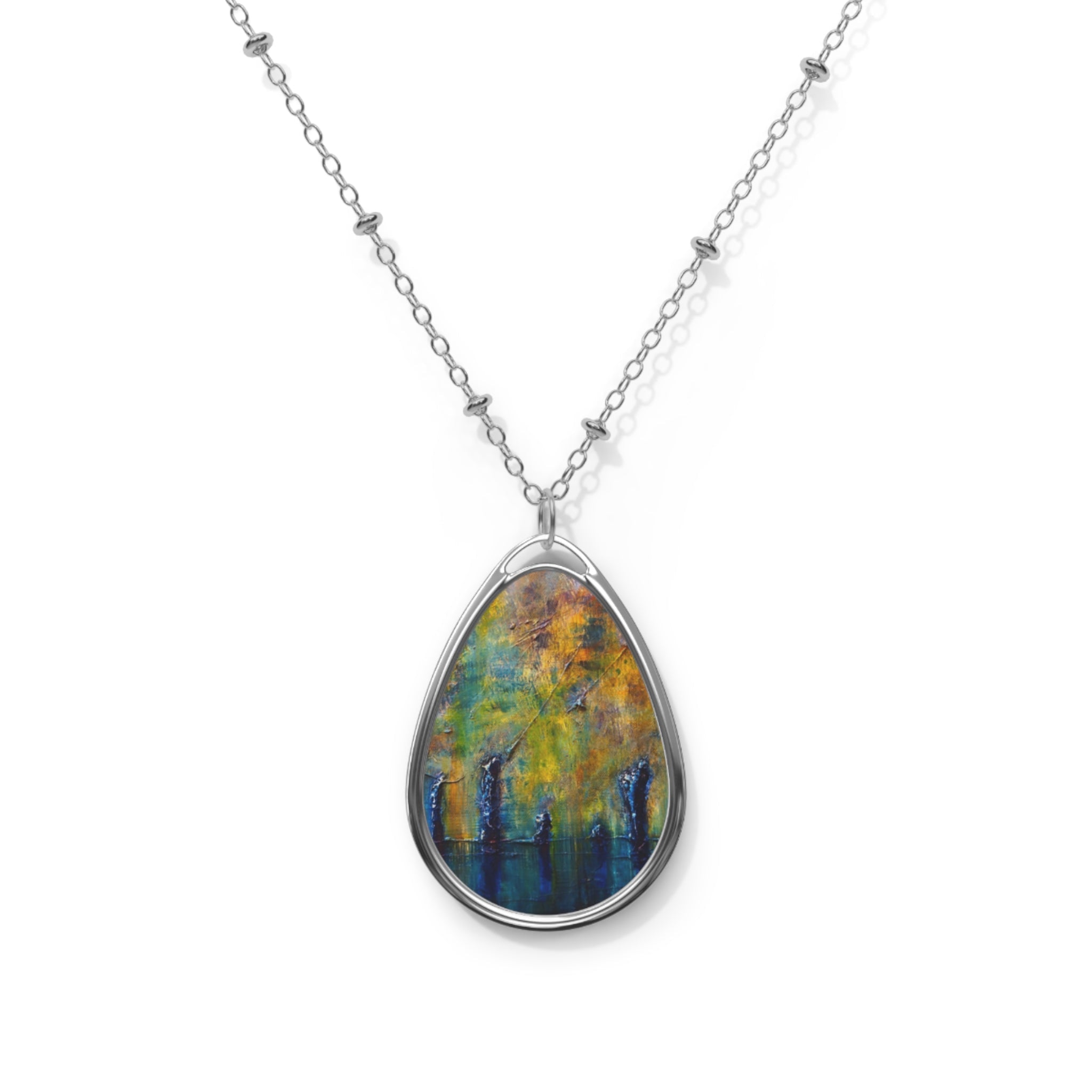 Silver-chained necklace with teardrop pendant featuring colorful abstract landscape design