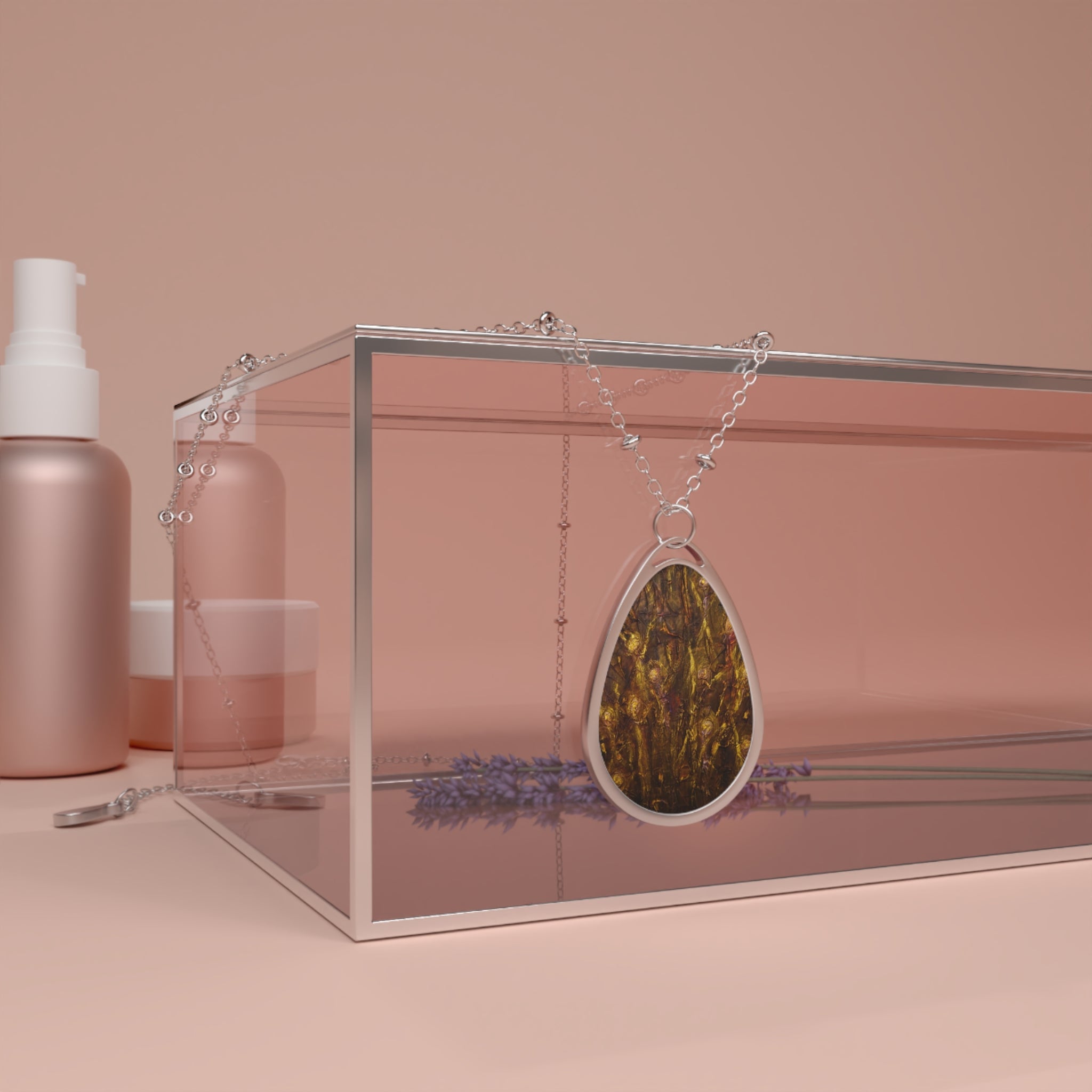 Silver-framed teardrop necklace with dark textured golden-brown stone from Tam O Shanter Witches collection