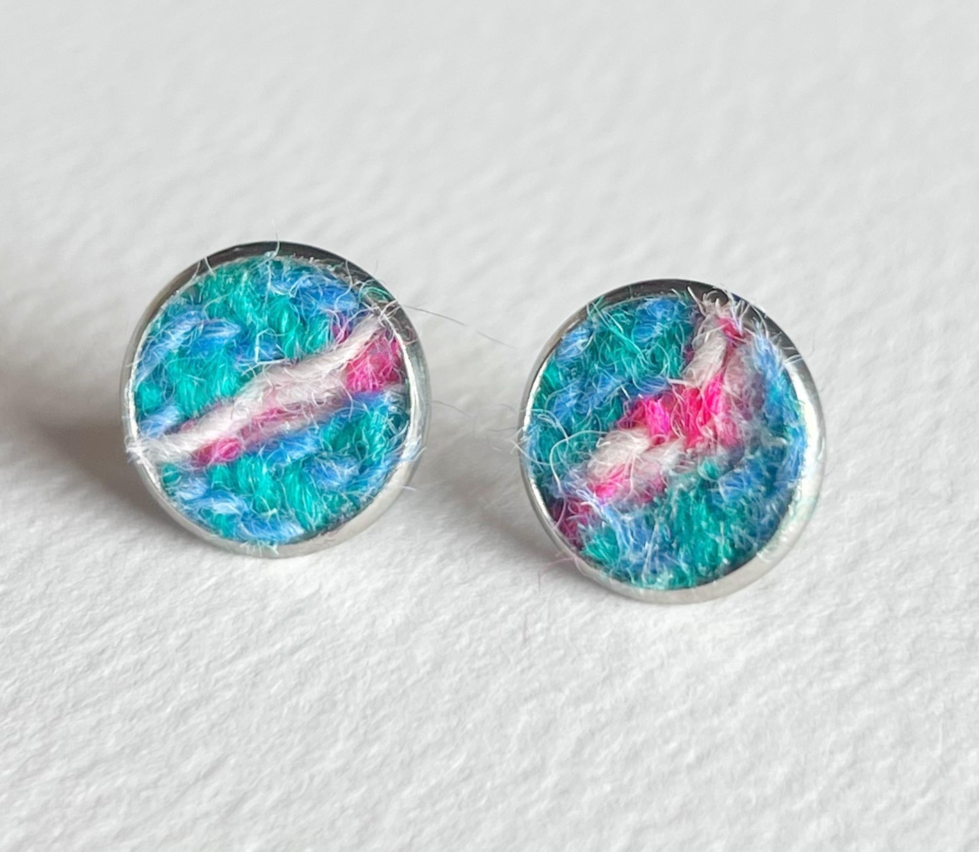 Round Harris Tweed stud earrings with textured multicolored design in blue, green, pink, and white