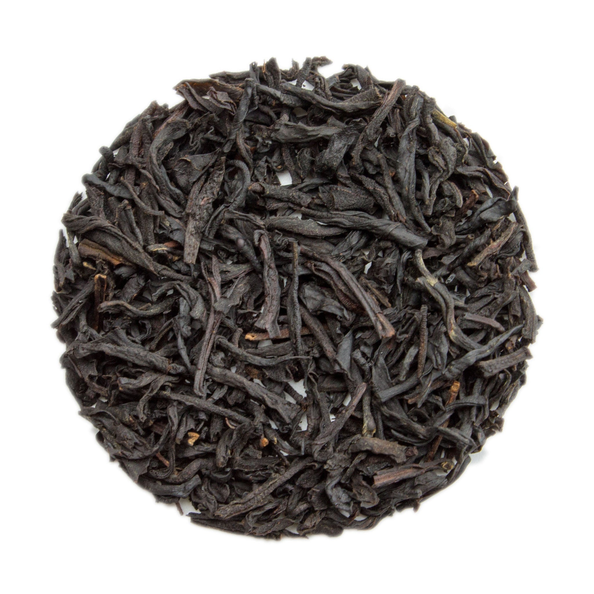 Dark twisted black tea leaves in circular mound for Vanilla Black Tea