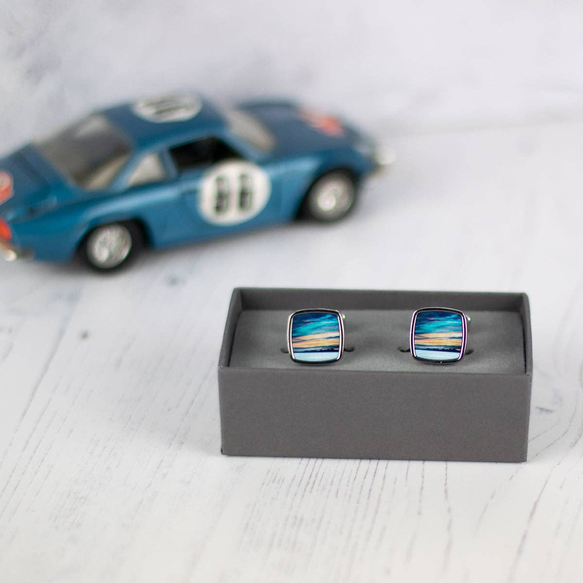 Square Skye sunset cufflinks in blue orange silver frame by Cath Waters