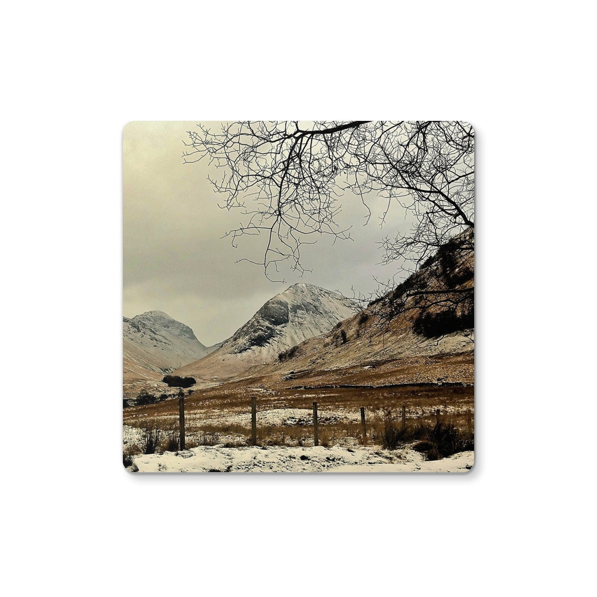 Sepia-toned Winter In Glencoe coaster with snow-covered mountains and bare trees