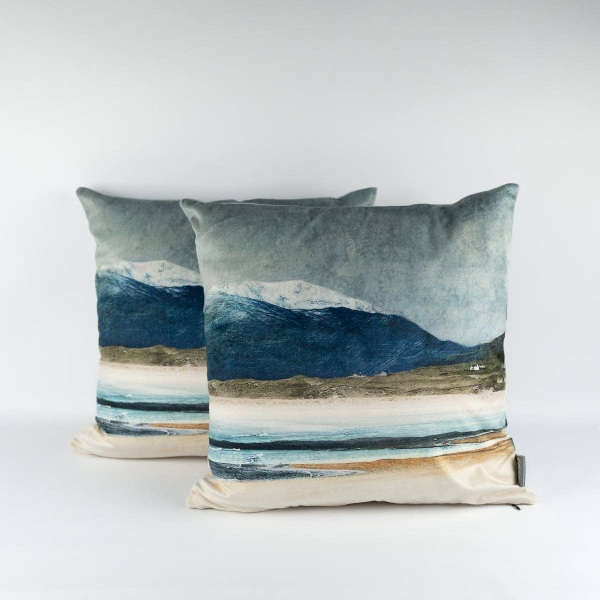 Winter Luskentyre Isle of Harris velvet cushion with painterly snow-capped mountains and coastal waters in blue, gray, and beige